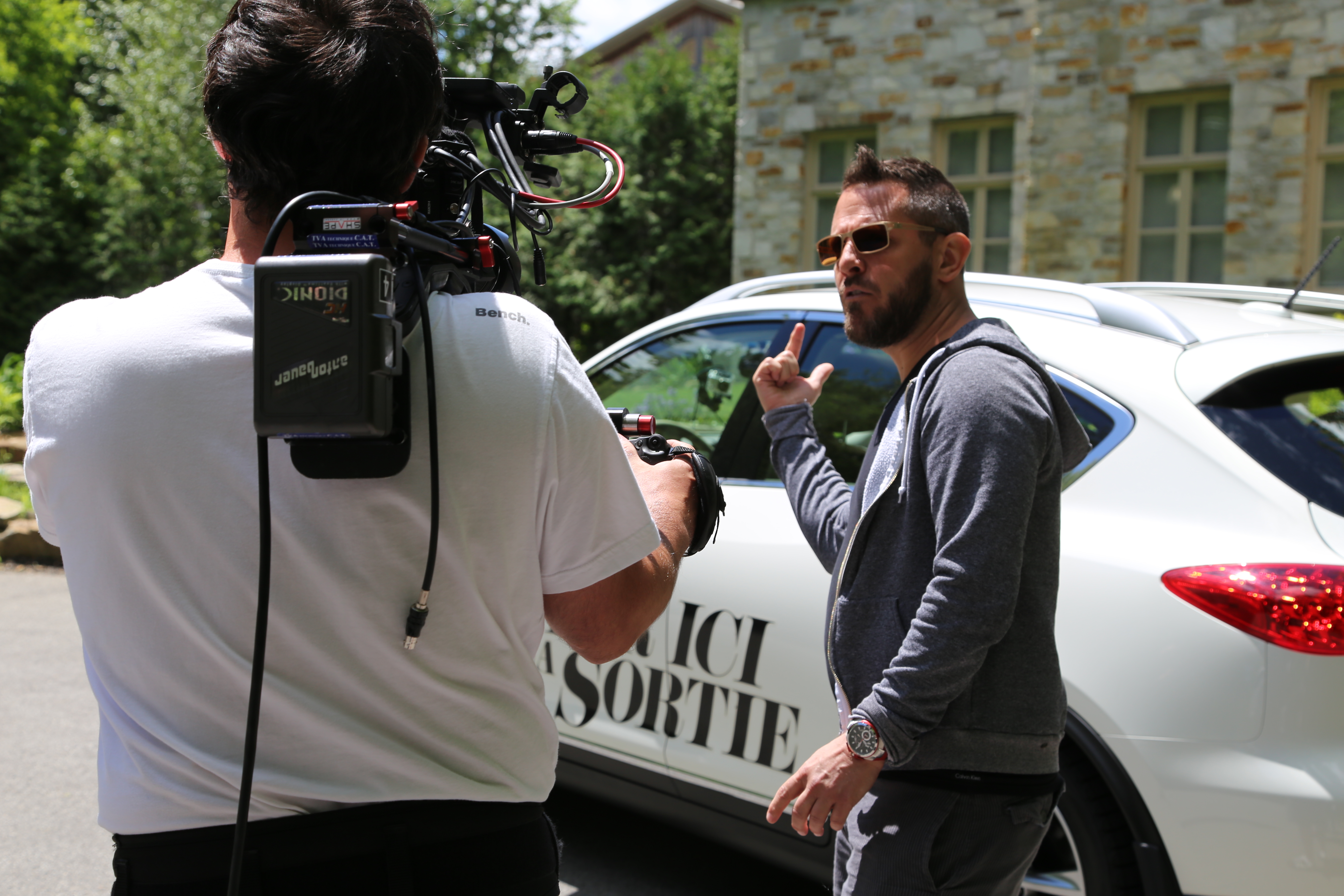 Director David Boisclair on the set of PAR ICI LA SORTIE (HERE'S THE EXIT), 2013.