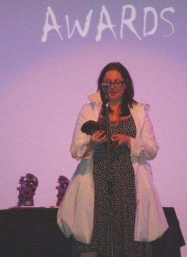 Writer/director of THE COMMUNE Lis Fies accepting a coveted skull Brammy for Best International Feature Film at the Bram Stoker International Film Festival