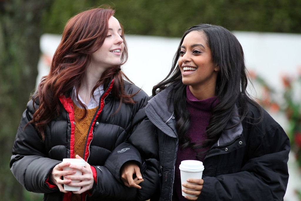 Kacey Rohl and Azie Tesfai walking with coffees on the set of 'This American Housewife' in Vancouver, Canada.