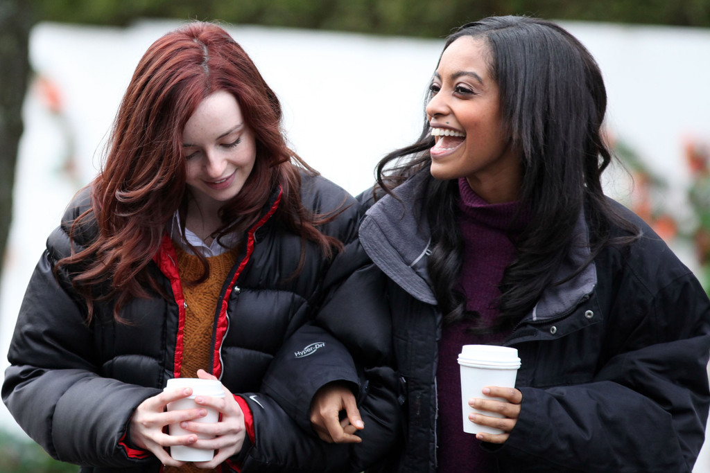 Kacey Rohl and Azie Tesfai walking with coffees on the set of 'This American Housewife' in Vancouver, Canada.