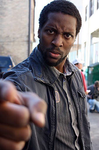 Aaron D. Alexander as Black Rick on set of Post-Racial (short).