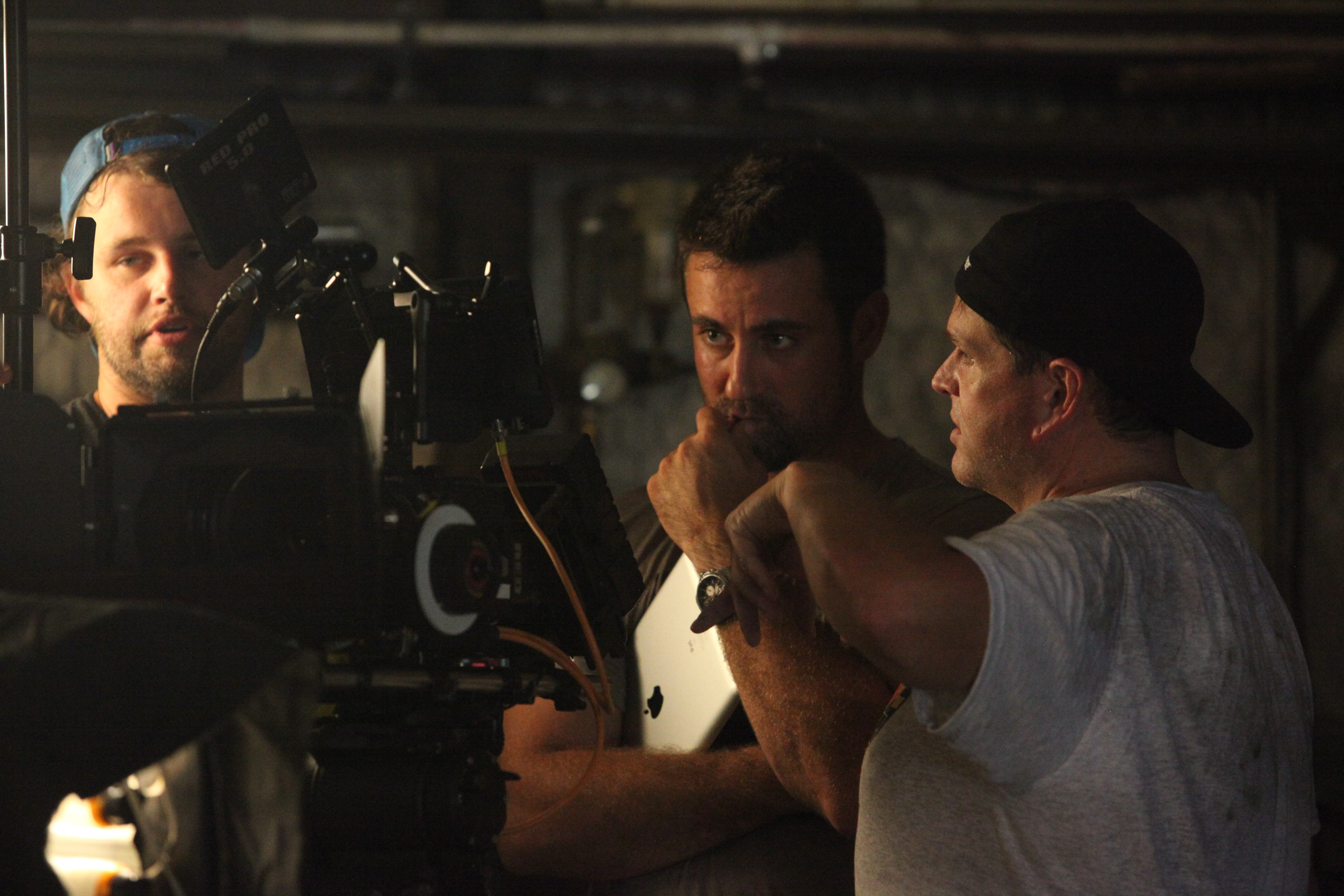Directors Ron Lester and Major Dodge discuss the shot with DP Jason Burks