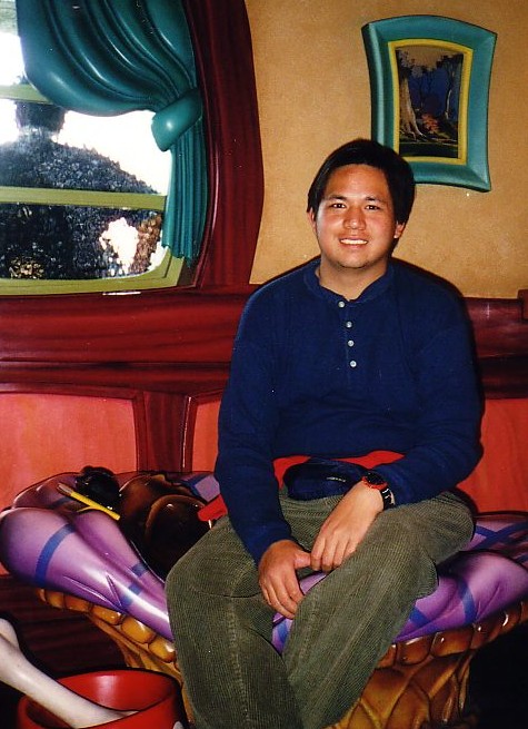 Edmund K Lo sitting on Pluto Dog Bed at Mickey Mouse House on October 2011. (Disneyland)