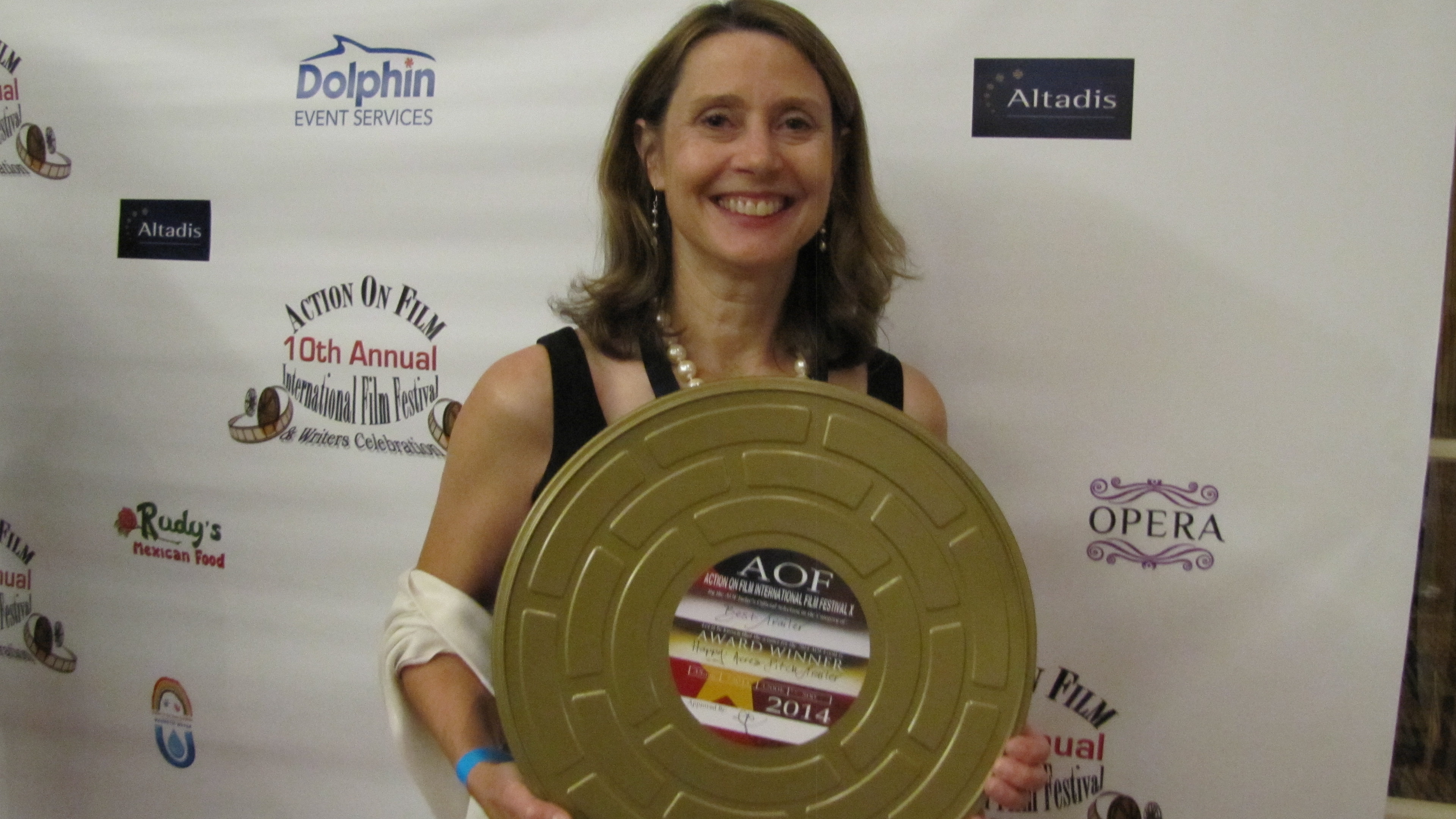 Colleen at the AOF with her award for 