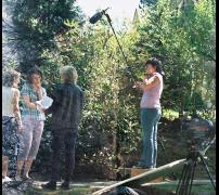 Lynn Denton directing actors Colleen June McQuaide and Mary Kickel on set of 
