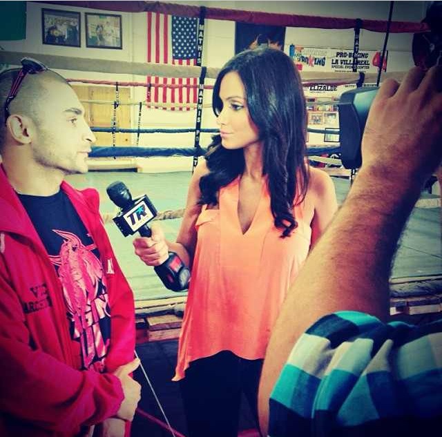 Crystal Marie Denha interviewing Vic Darchinyan for Top Rank Boxing at media day workouts.