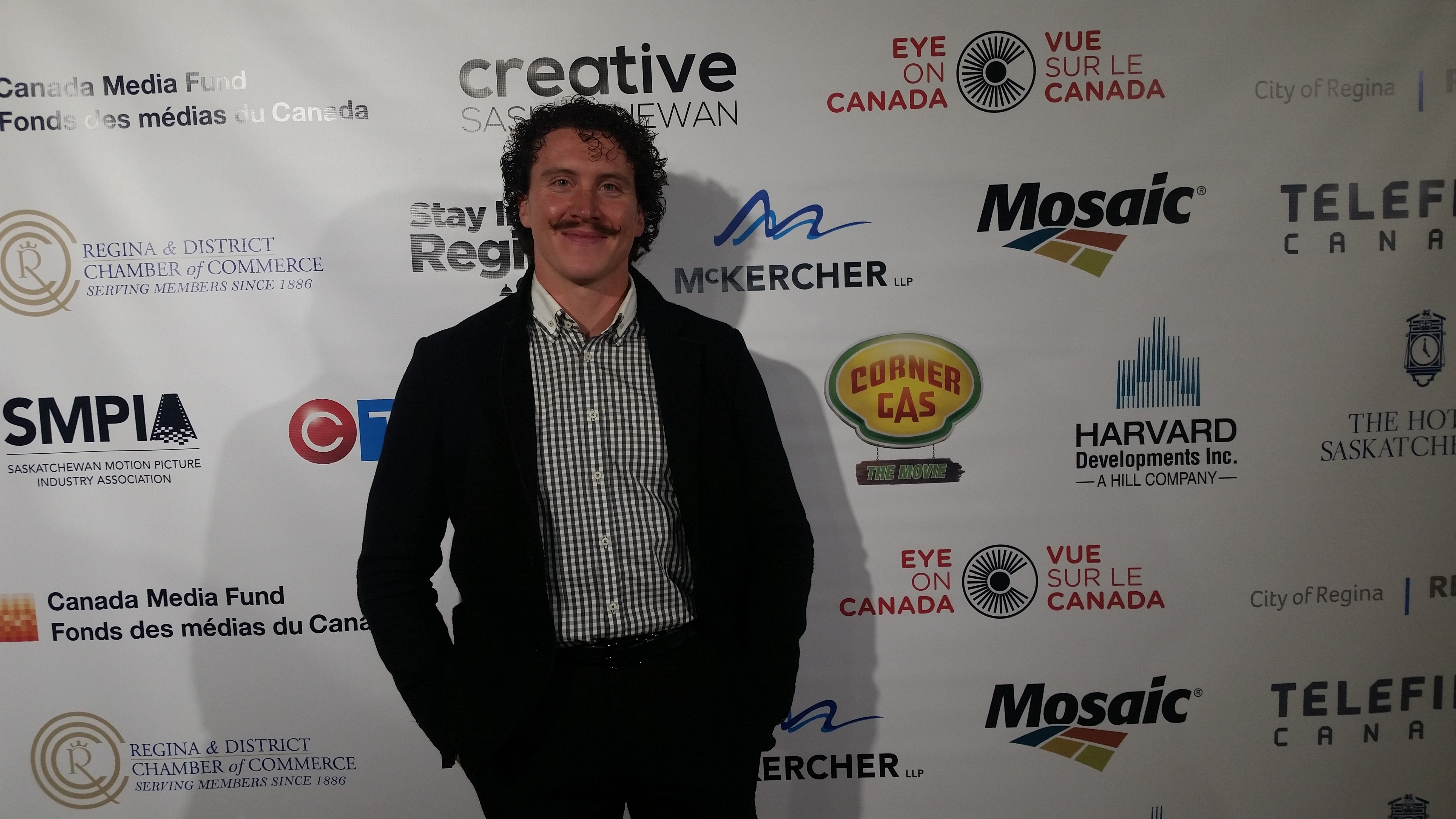 Dustin MacDougall walking the Red Carpet at the Regina, SK premiere of Corner Gas: The Movie.