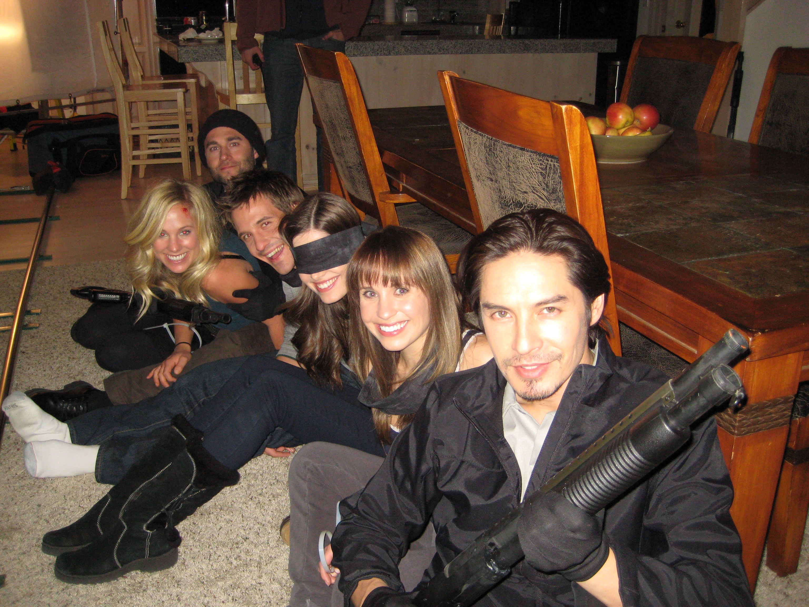 Michael Teh with happy hostages in the 2011 film 