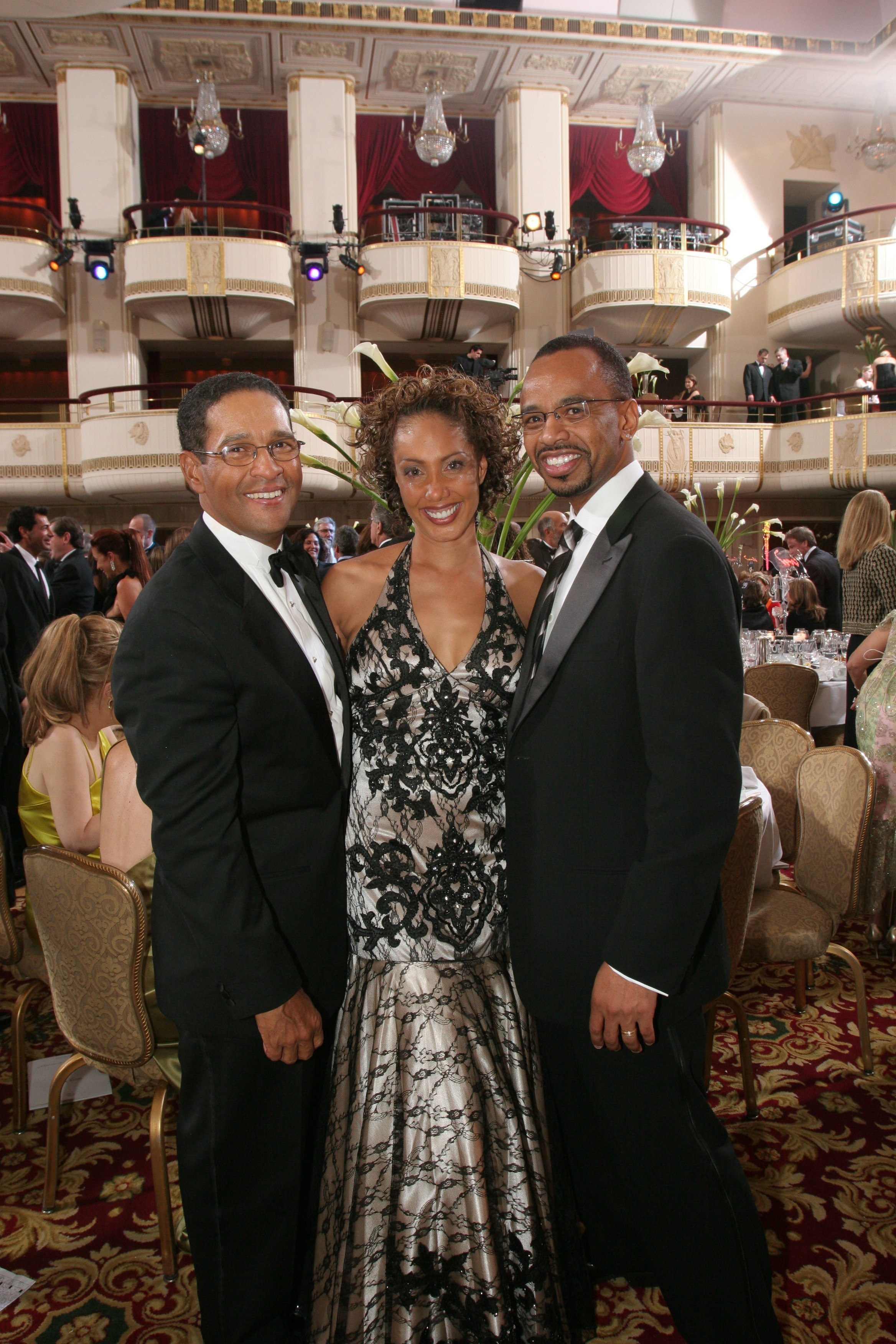 Joan Baker arm and arm with Bryant Gumbel and husband Rudy Gaskins- Guests of the Rita Hayworth Gala at the Waldorf Astoria.