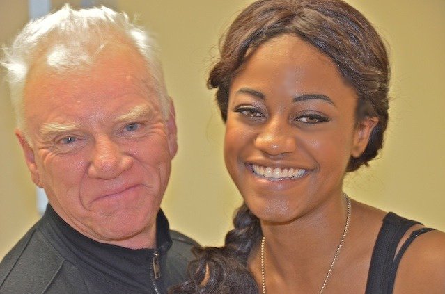 Malcolm McDowell and Desiree McKinney exchanging giggles on the set of Zombex