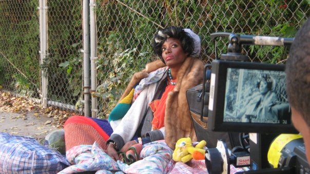 Sophisticated Homeless Woman on the set of JaRule's video 