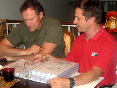 Max and Michael Rooker looking at the storyboards of their next film 