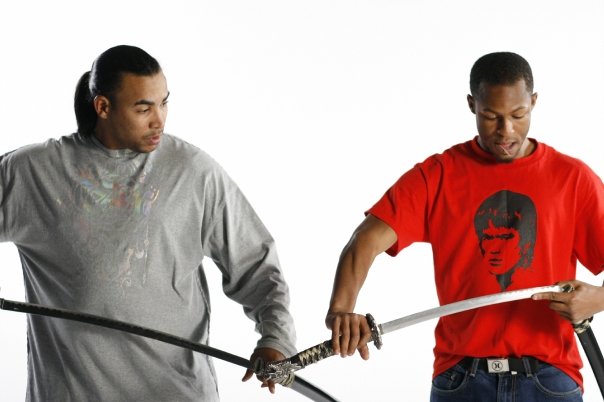 Emmanuel Brown training Don Omar in martial arts for a video shoot.