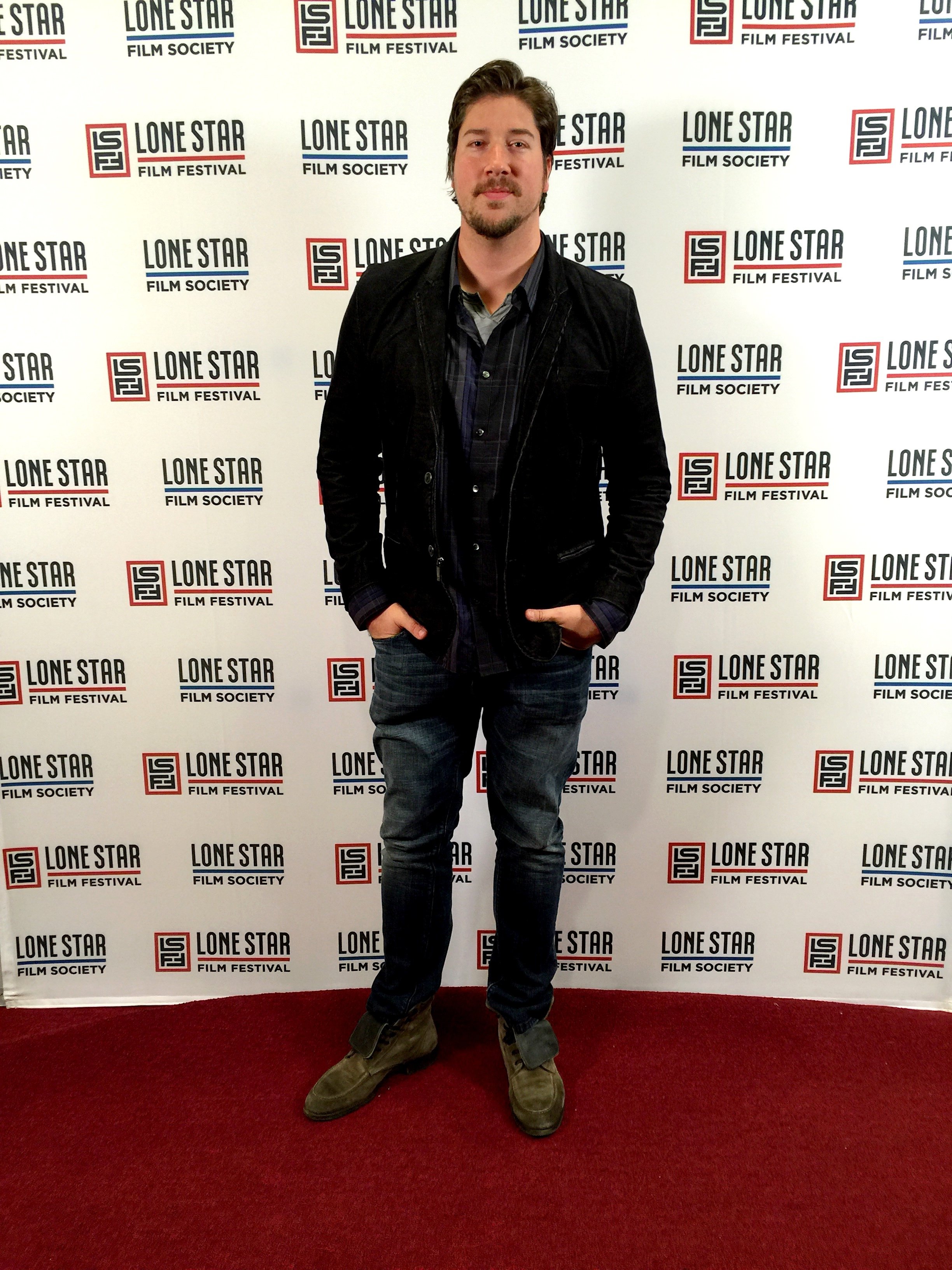 Tanner Beard on the carpet at the Texas Premier of 