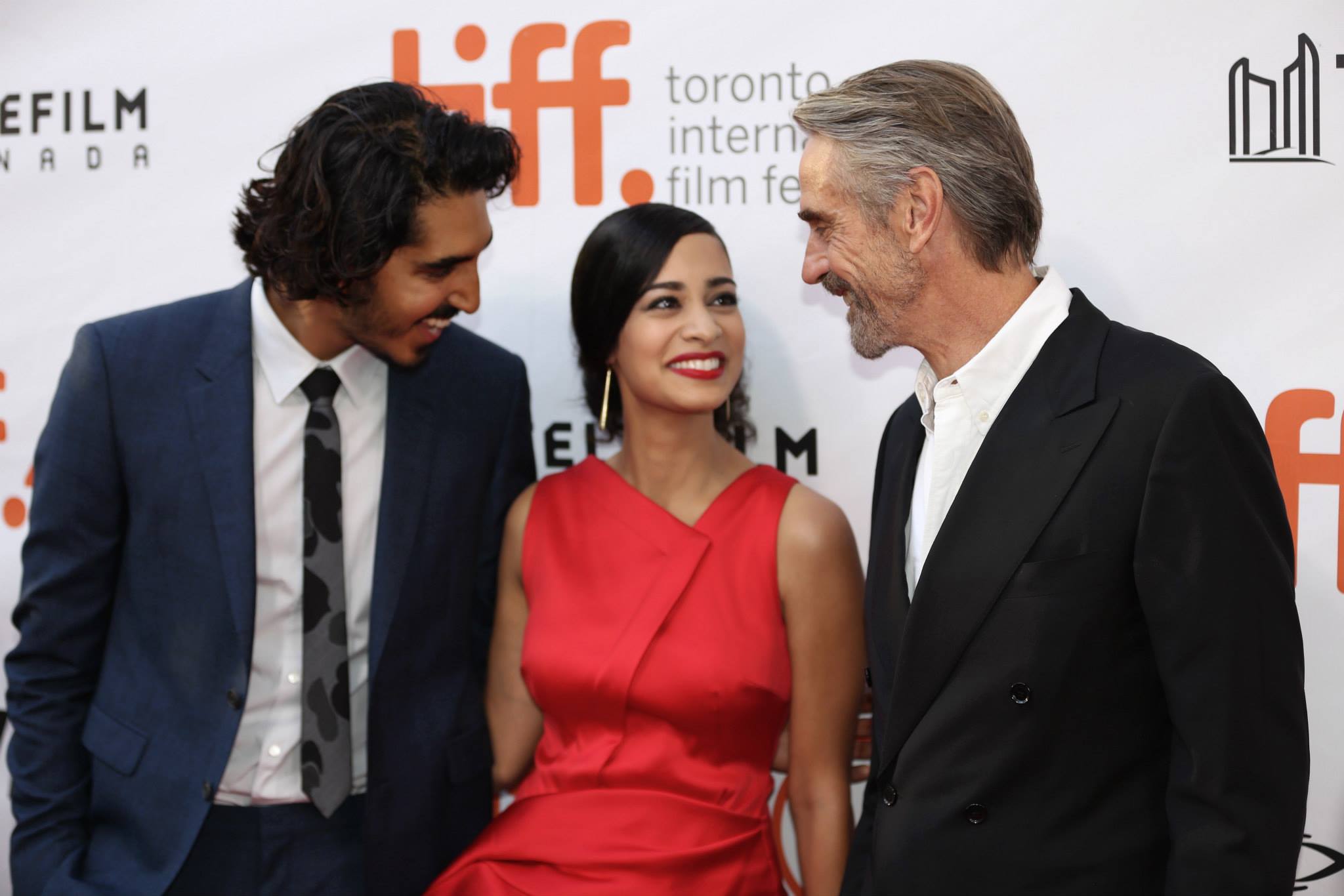 Dev Patel, Devika Bhise, and Jeremy Irons at the Toronto International Film Festival for the global premiere of The Man Who Knew Infinity