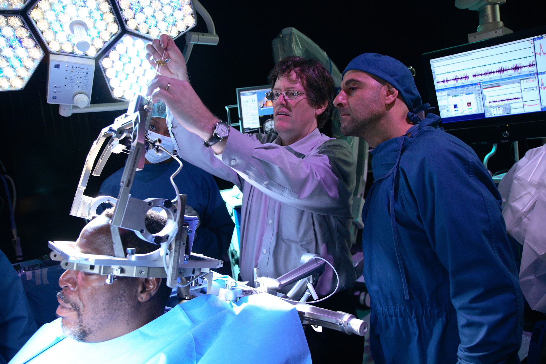 Teaching Stanley Tucci the technique of Deep Brain Stimulation.
