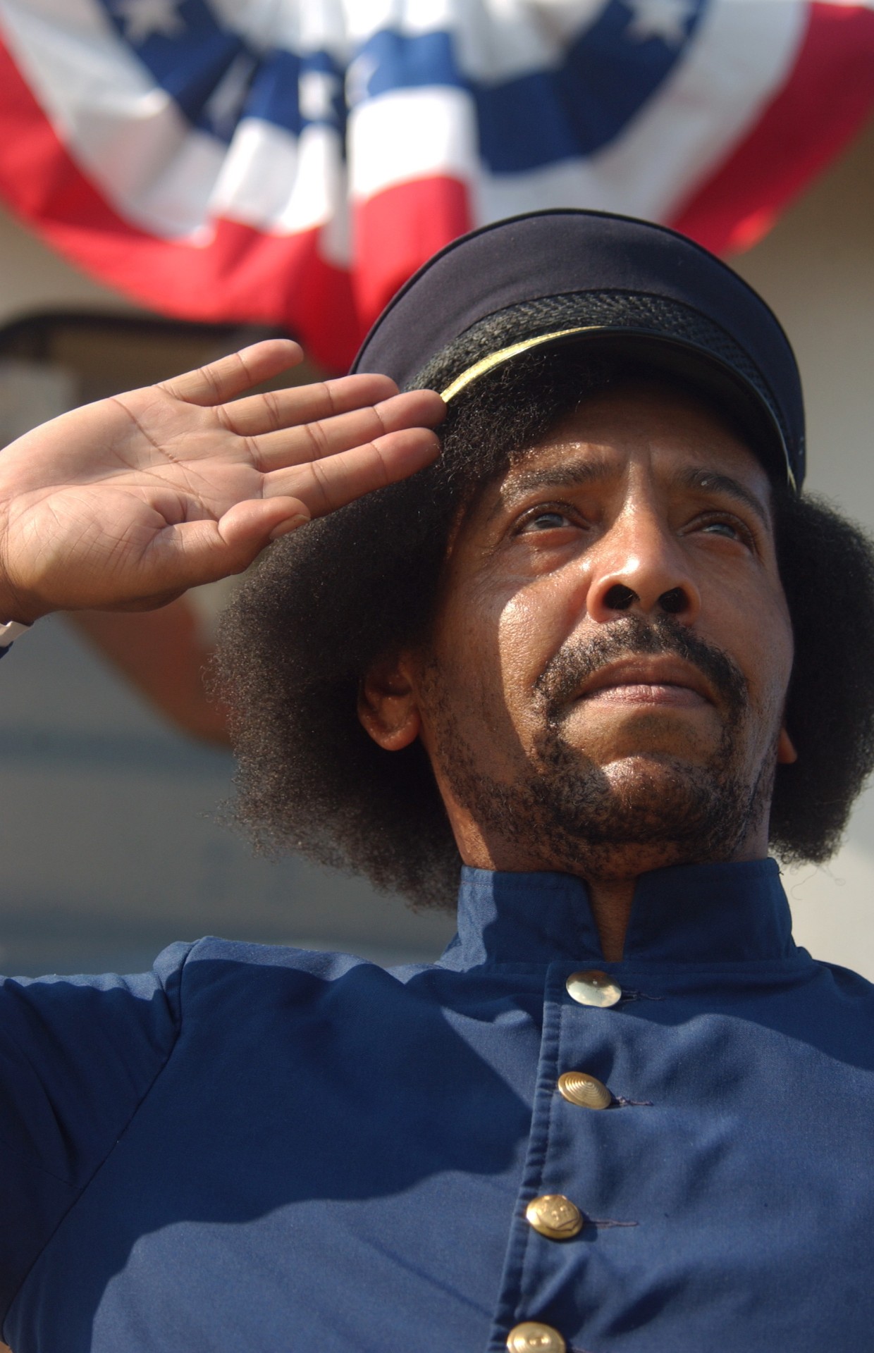 Algernon Ward Jr. salutes while portraying Robert Smalls in episode #4 