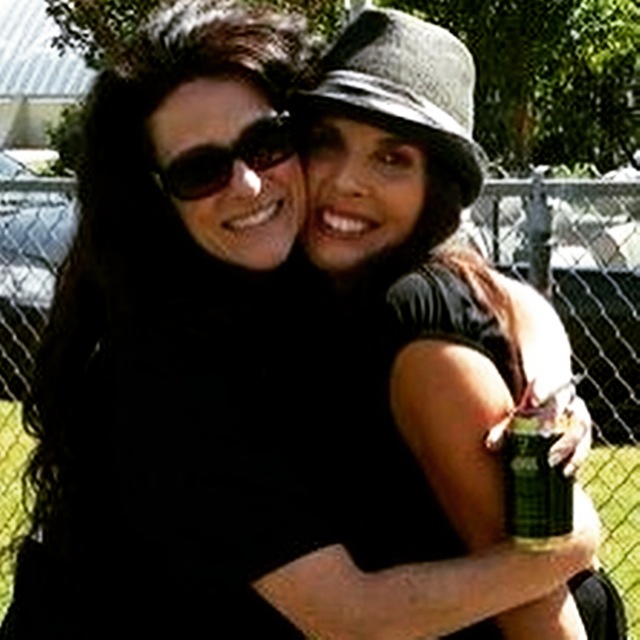 Kyla Robinson & Lesia sharing a big hug at the Hell on Wheels & Heartland Charity baseball game 2013