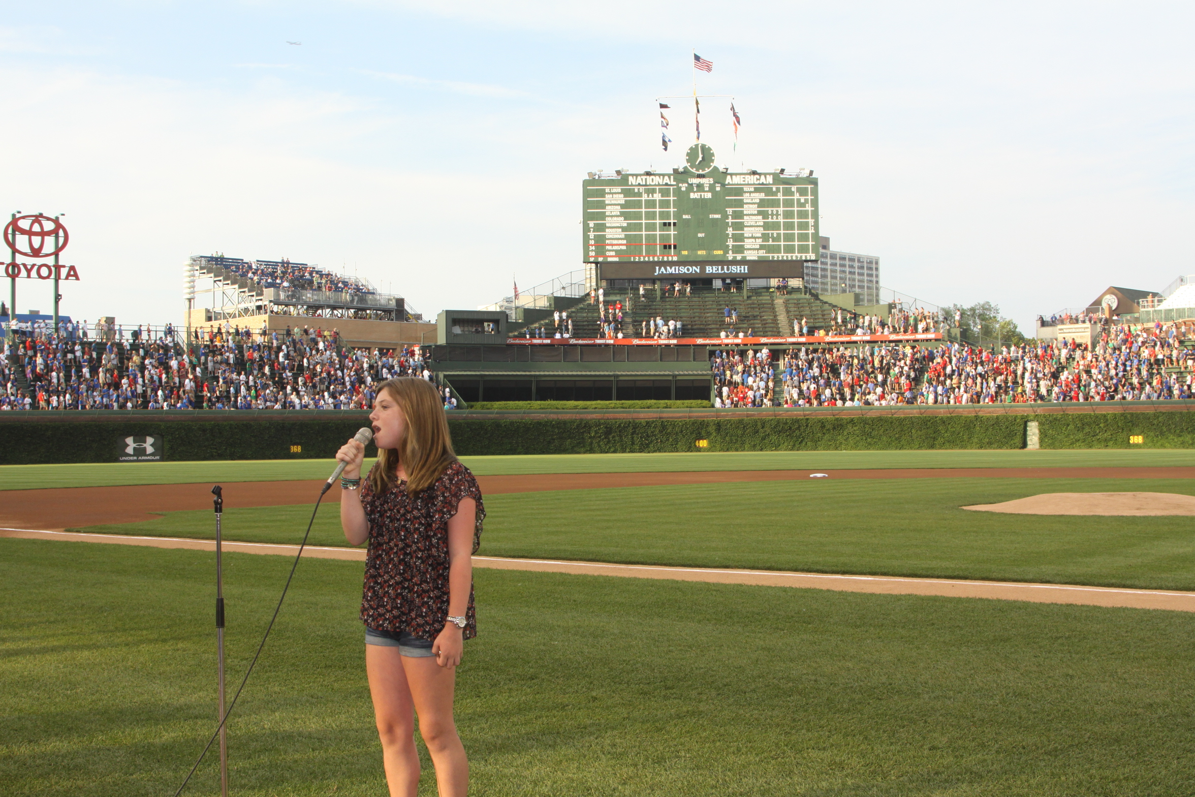 Jami sings the National Anthem at Wrigley Field.