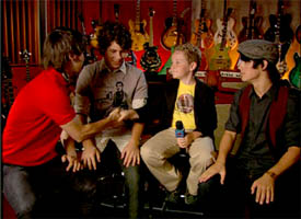 Jacob Hays as reporter Sonny Raines interviews the Jonas Brothers in NYC