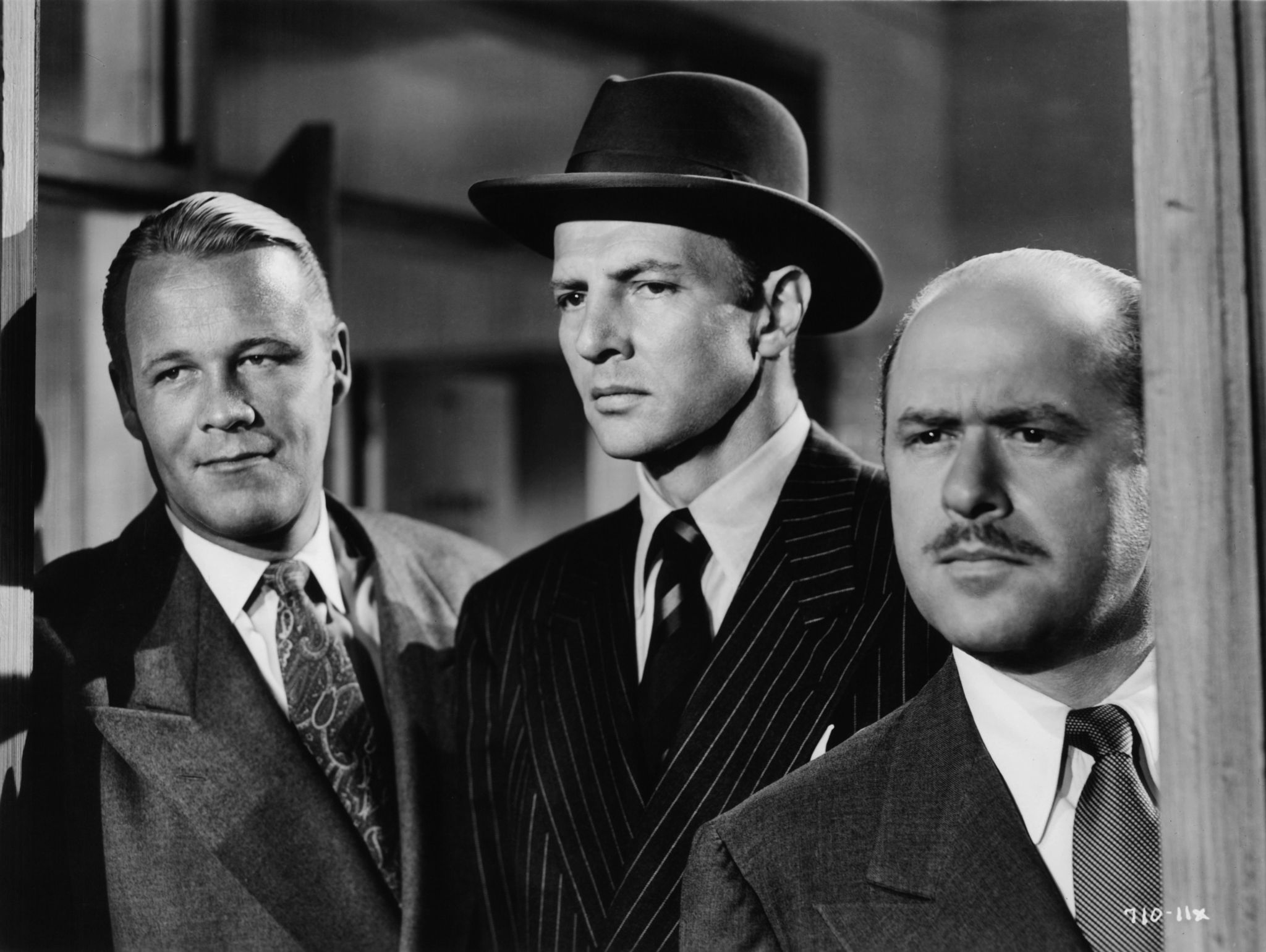 Still of Bruce Bennett and Wayne Morris in The House Across the Street (1949)