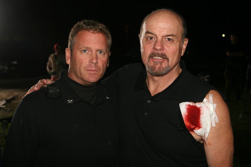 Tony Senzamici as Commander Sykes and Michael Ironside on the set of Mutants.