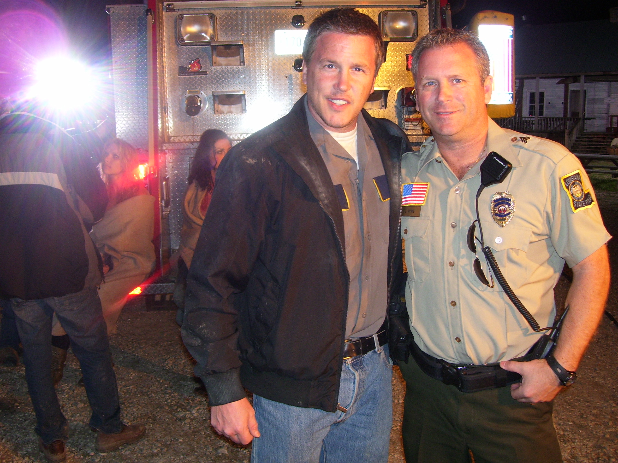 Tony Senzamici as State Trooper Ayme & Lochlyn Munro on the set of Xtinction.