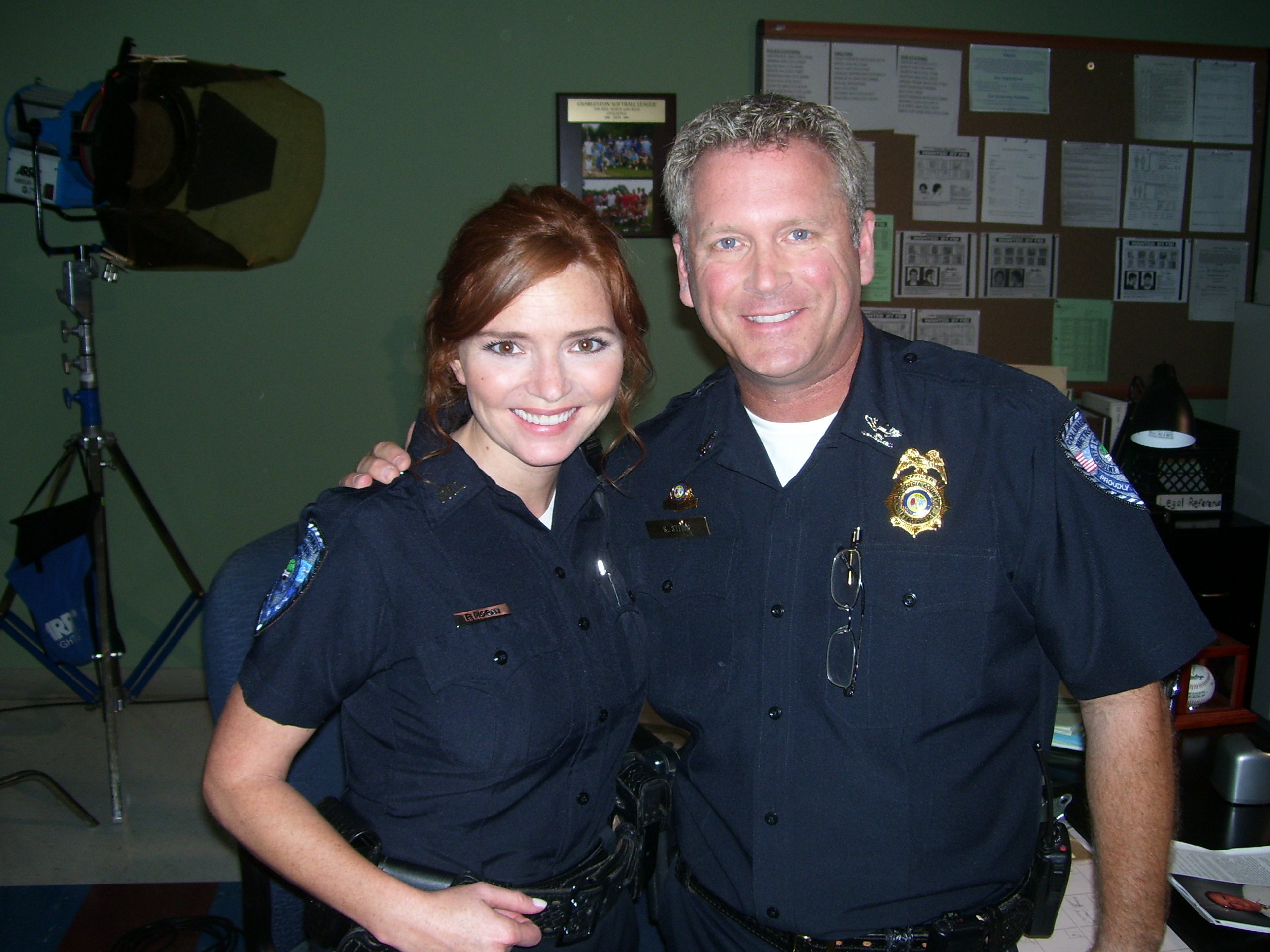 Tony Senzamici as Police Chief Stites with Brigid Brannagh as Officer Pamela Moran on the set of Army Wives. Episode 513, Farewell to Arms.