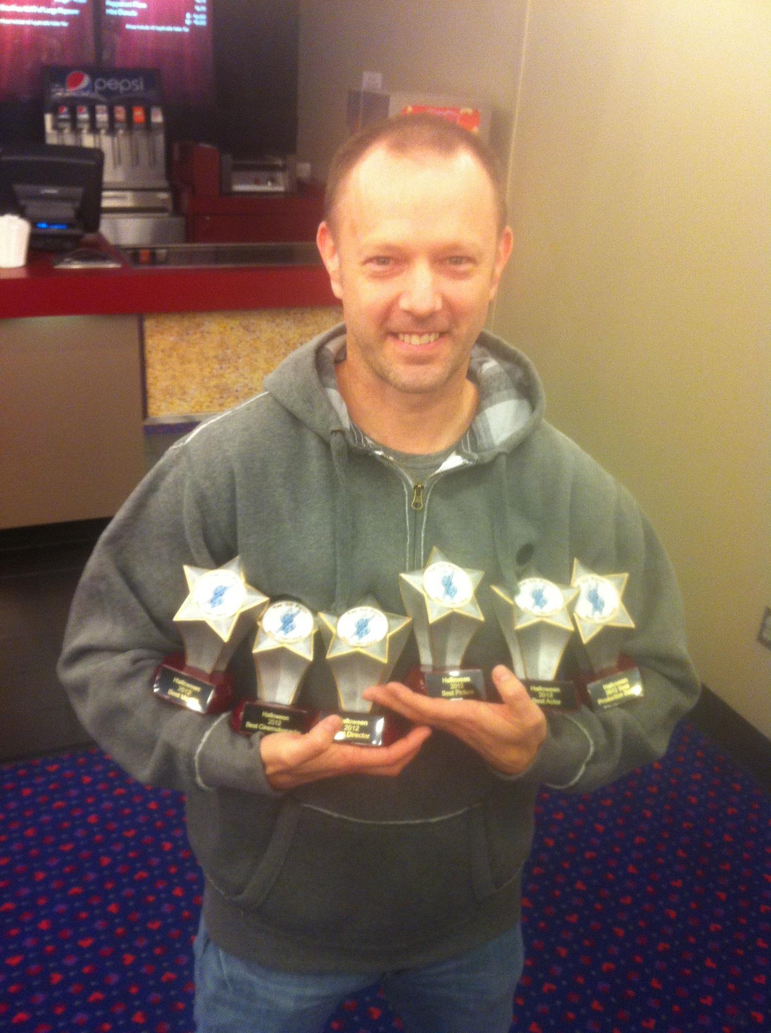 Chars with his awards for 