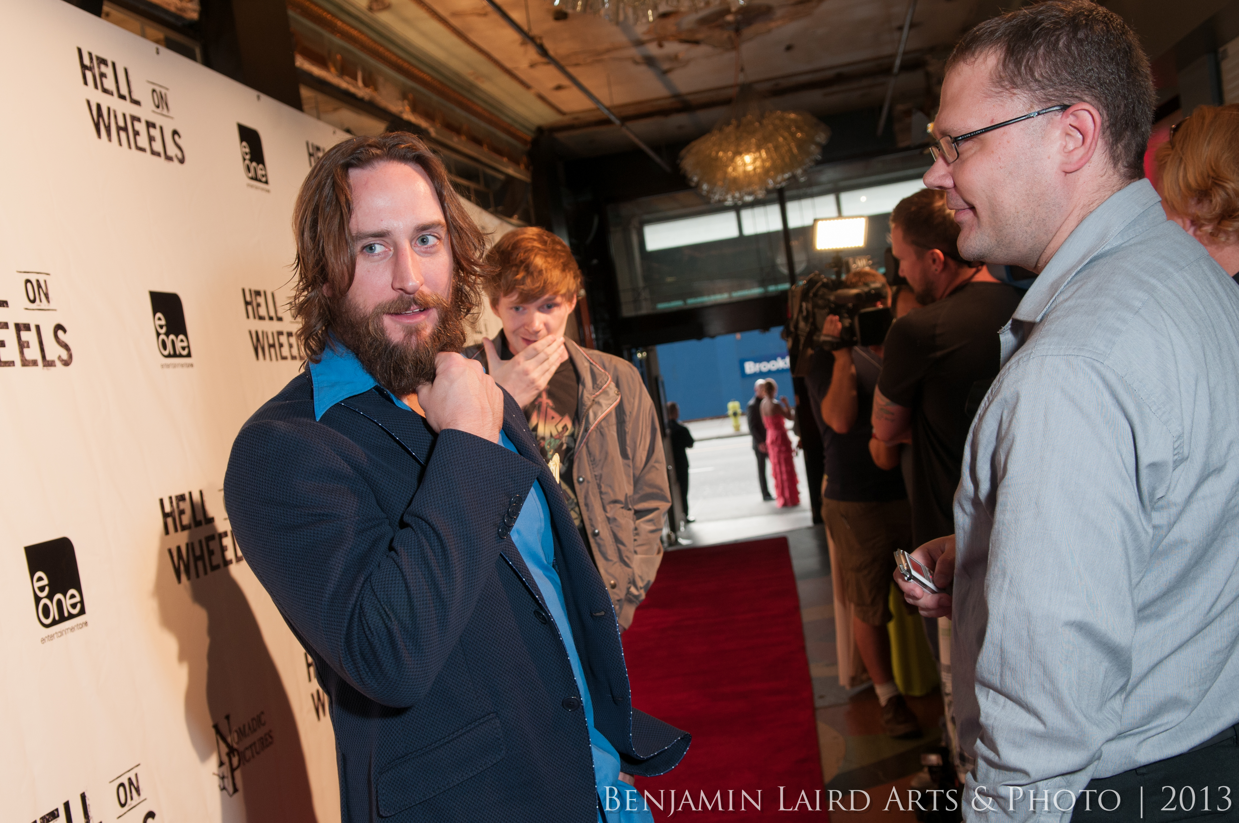 Phil Burke and Ben Esler walk the red carpet at the Hell on Wheels Season 3 Premiere.