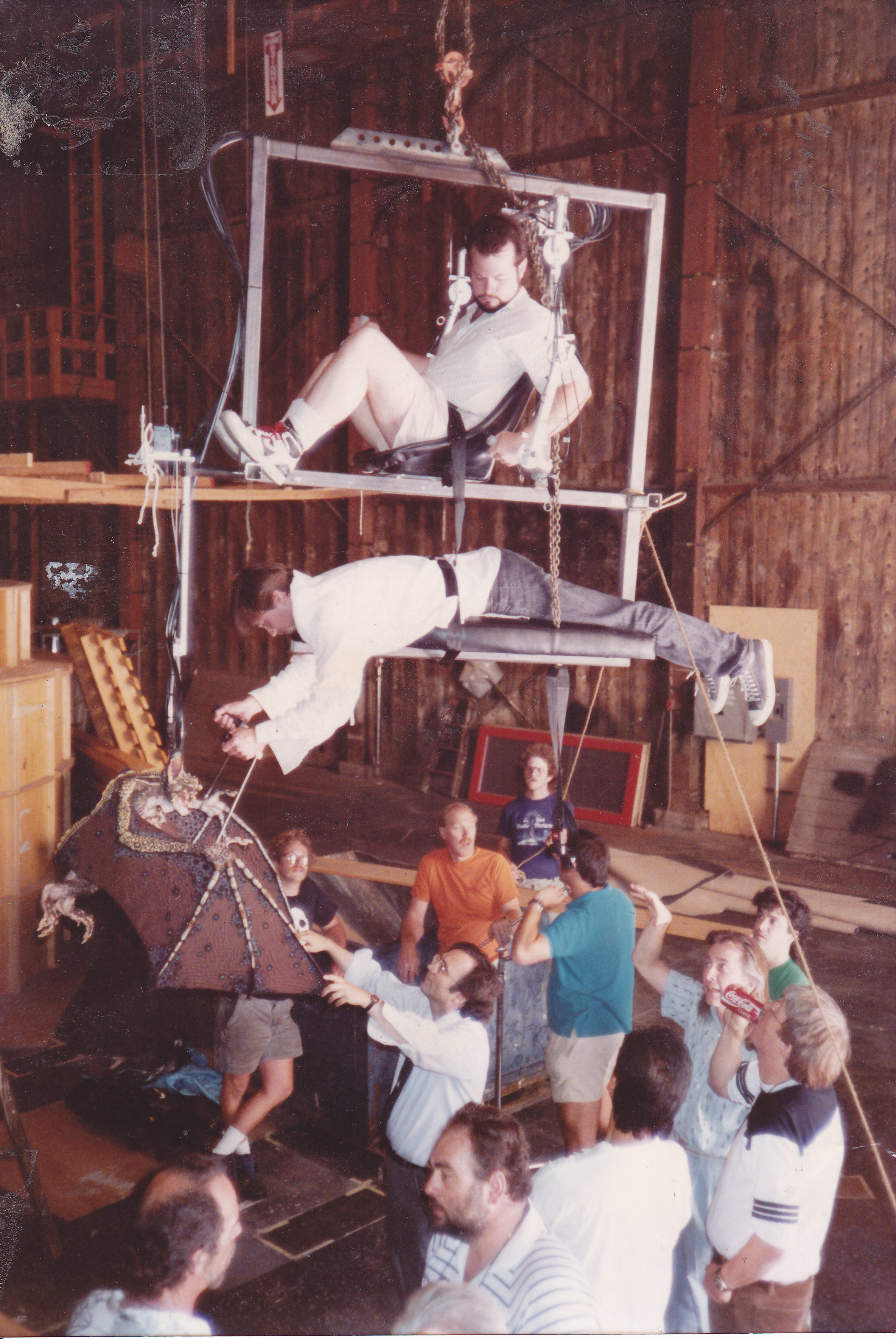 Gremlins 2 (1990) 1st Unit. Demonstration of Bat Gremlin rig. Tim Lawrence in telemetric saddle. Steve Sleap on wings. Joe Dante, Rick Baker and John Hora also present.