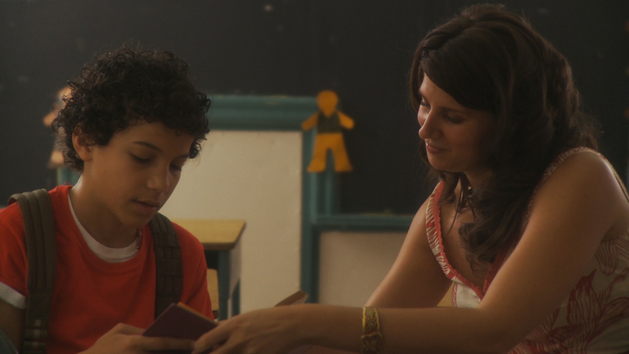 Quentin Araujo, and Erin Fogel, as Mrs. Mills, in a still from 