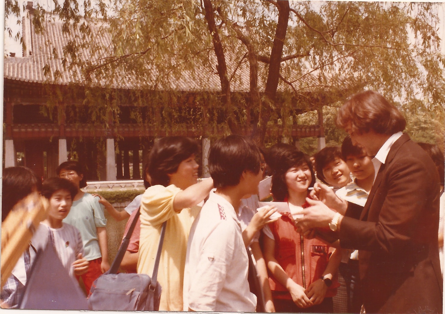 Signing autographs for a few Korean Kids. 1985.