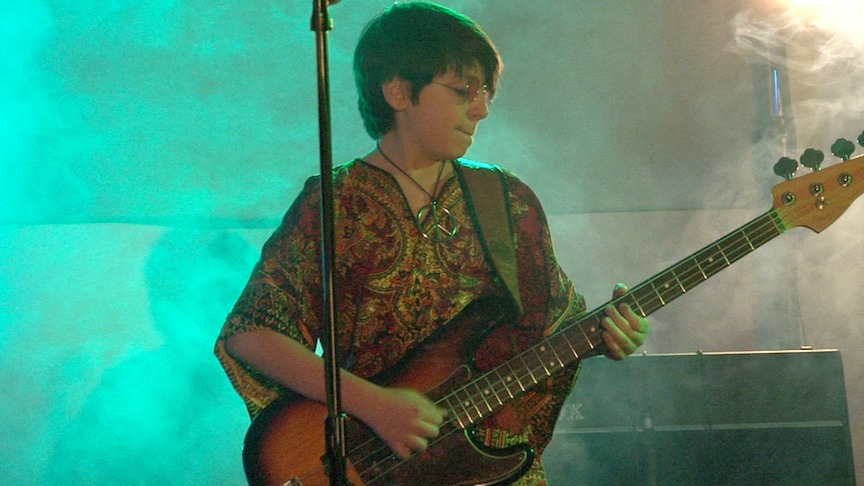 Evan Materne on bass at The Beatles tribute show