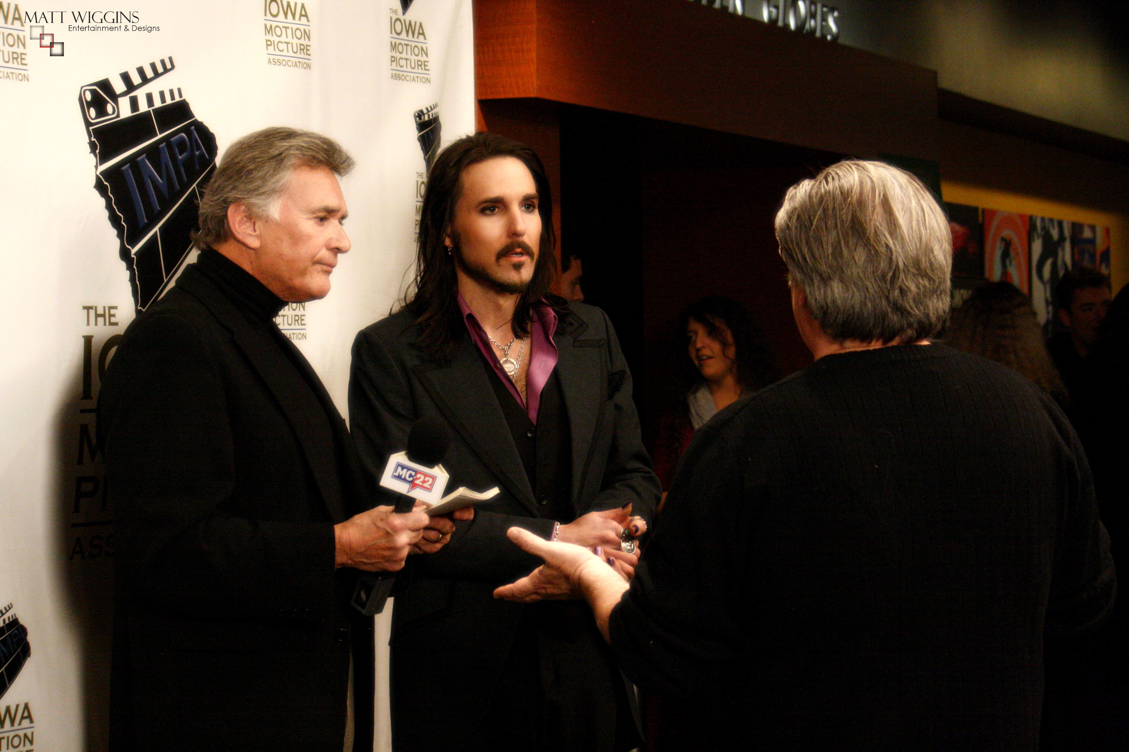Matt Wiggins is briefed before an interview at the Iowa Motion Picture Association's Golden Globes Event in 2014.