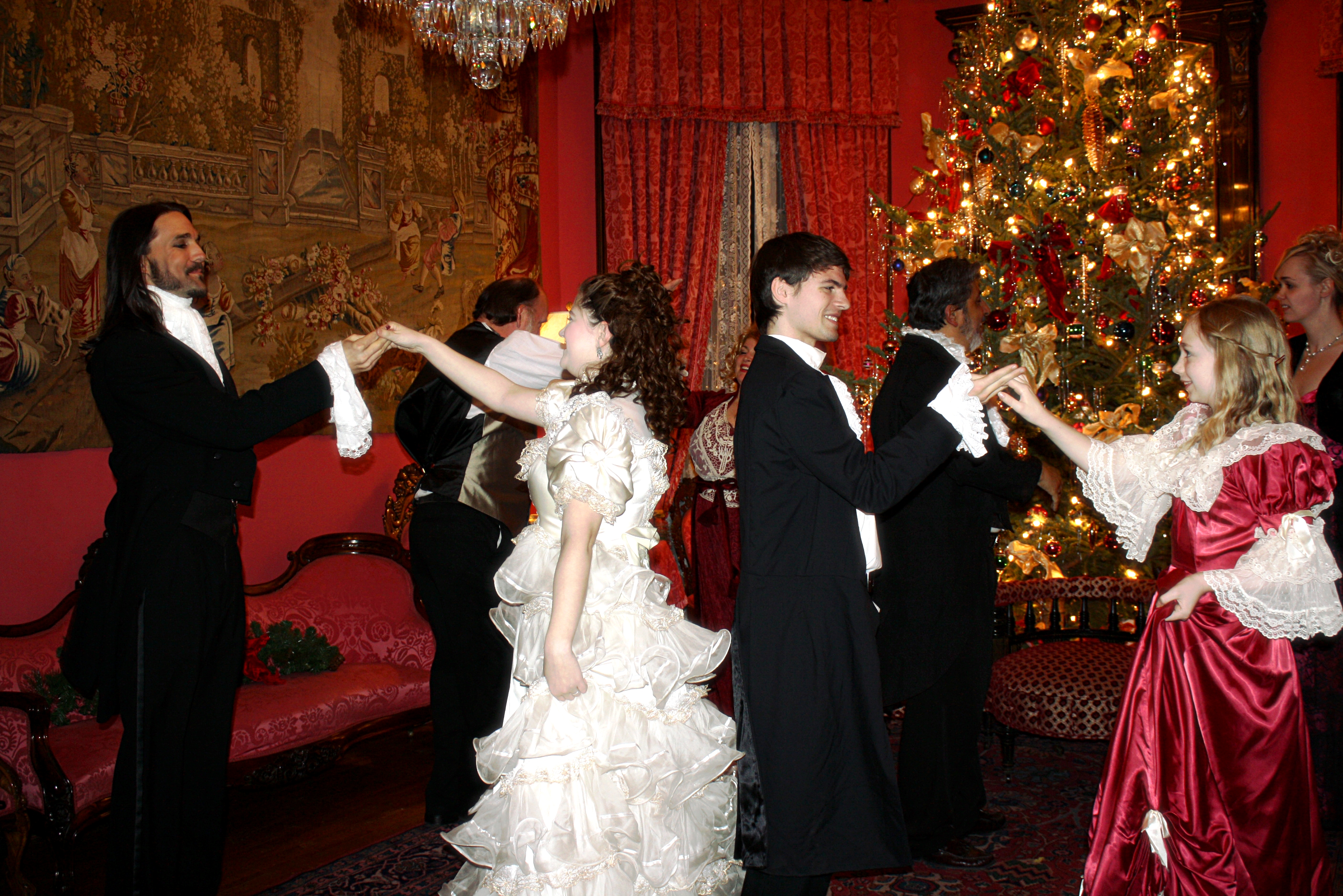 Still of Matt Wiggins as Young Scrooge with fellow cast members of the 2013 live production of Charles Dickens, A Christmas Carol at the historic Terrace Hill Mansion in Iowa.