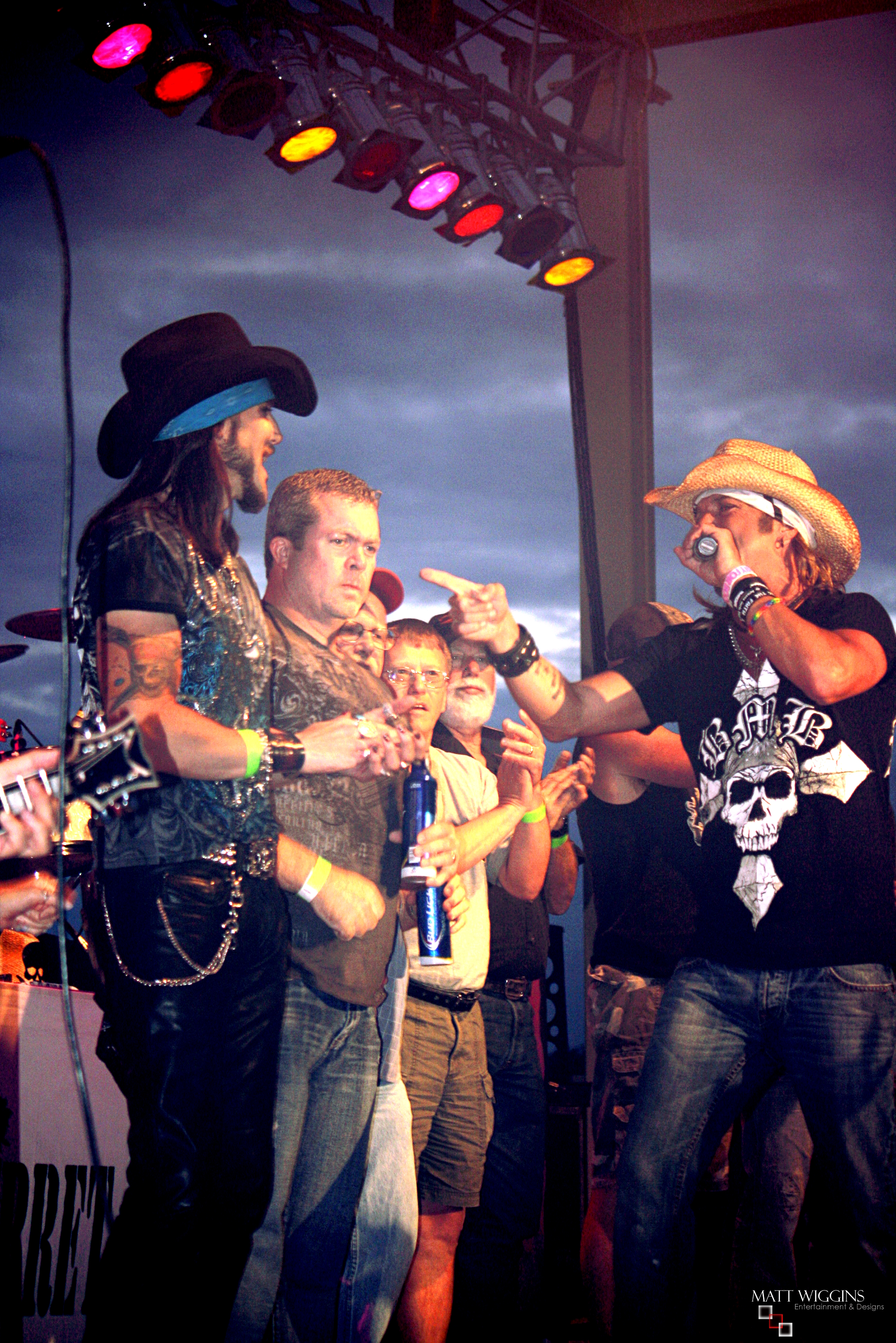 Matt Wiggins being greeted by Bret Michaels on stage in March 2014.