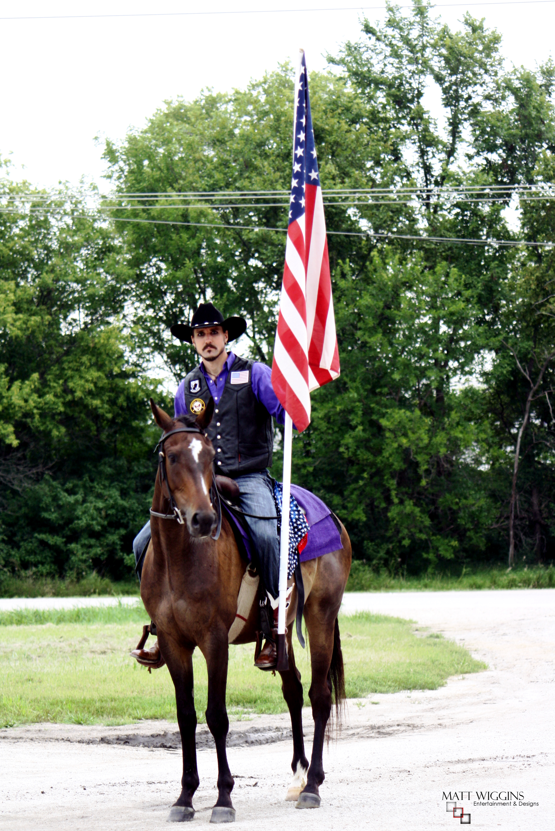 MATT WIGGINS prepares for parade on his thoroughbred SALVATORE appearance on behalf of fellow veterans in September 2014.