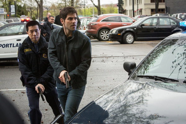 Still of Reggie Lee and David Giuntoli in Grimm (2011)