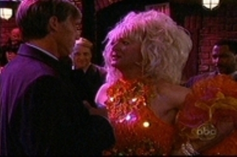 Hunt Block (back to camera) and Benjamin Howes as drag queen Harvey Dewitt in a scene from 