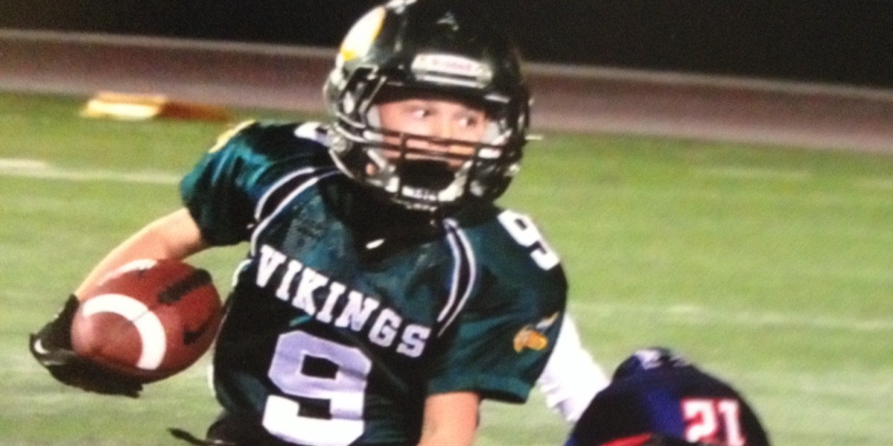 Mason Cotton playing football 2013