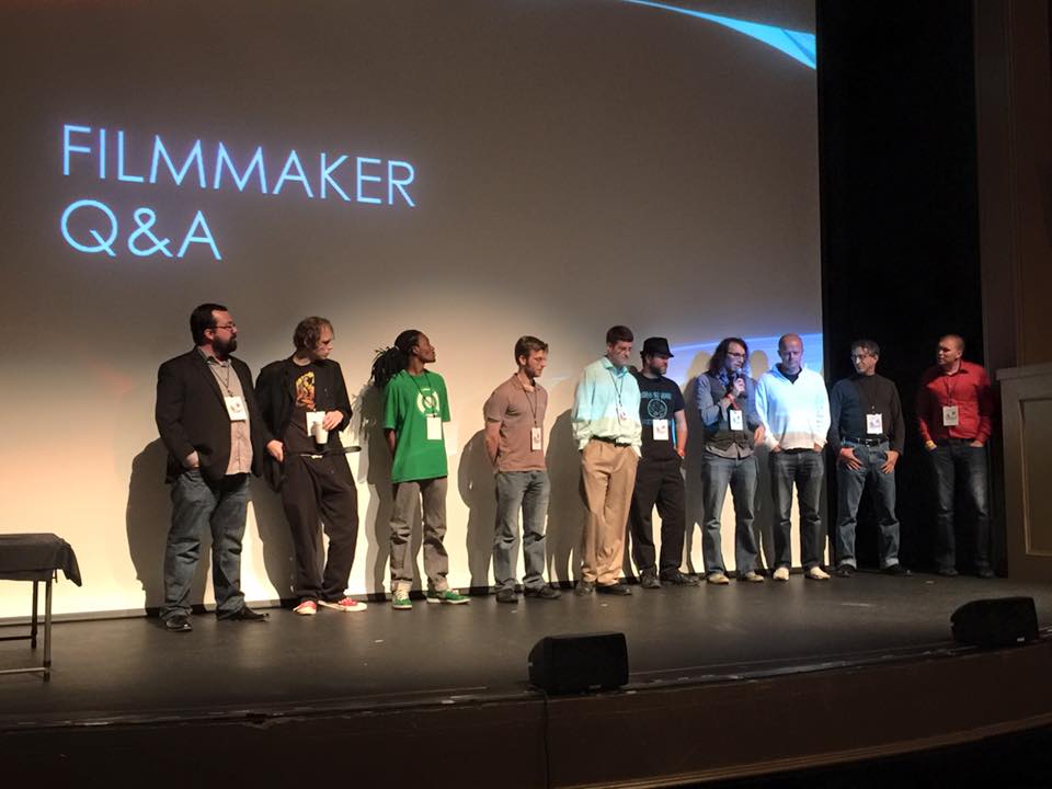 Jason Anthony Fisher (center), on stage with other filmmakers at the 2015 Marietta International Film Festival in Atlanta, Ga.