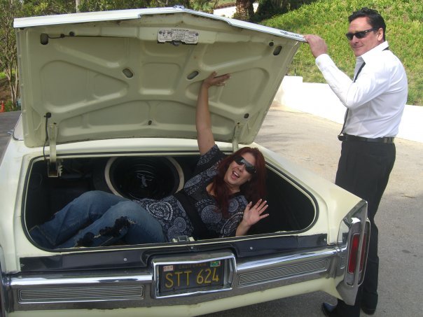 Fileena Bahris and Michael Madsen having fun with the car from Reservoir Dogs