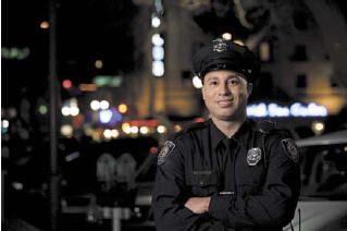 Marcus Jordan as a Police Officer on a photo shoot for University of Phoenix.