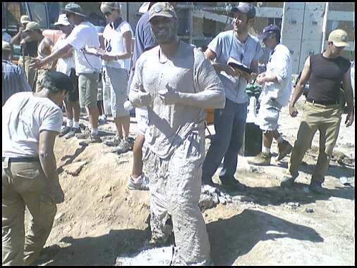 Marcus Jordan after digging in the muddy bomb site as Crime Scene Investigator in 