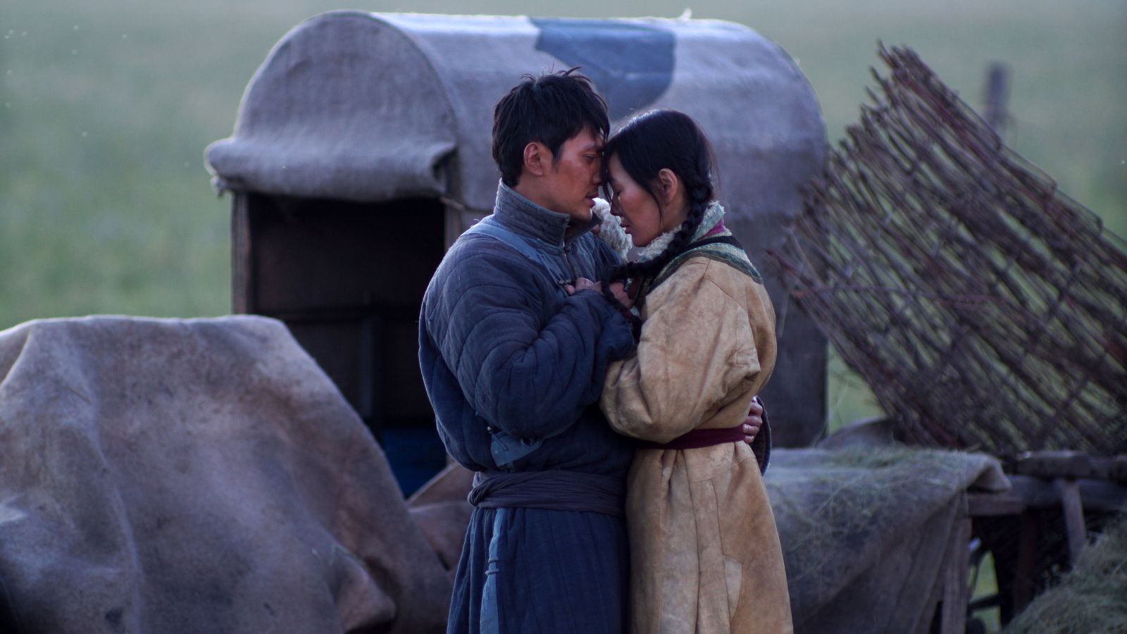 Still of Ankhnyam Ragchaa and Shaofeng Feng in Wolf Totem (2015)