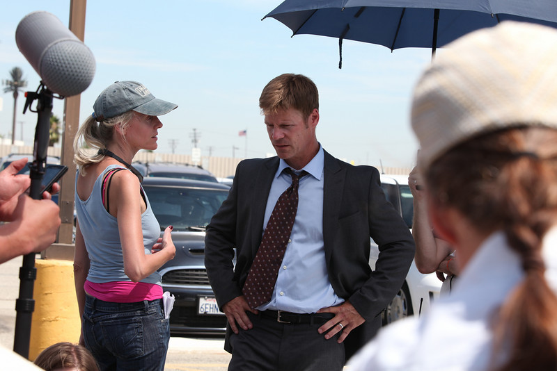 Director, Lisa Robertson, speaks with lead actor, Joel Gretsch, set of COMMERCE.