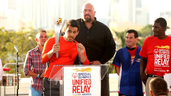 Geovanni Gopradi, actor and Special Olympics Goodwill Ambassador for the 2015 World Games, holds the Flame of Hope.