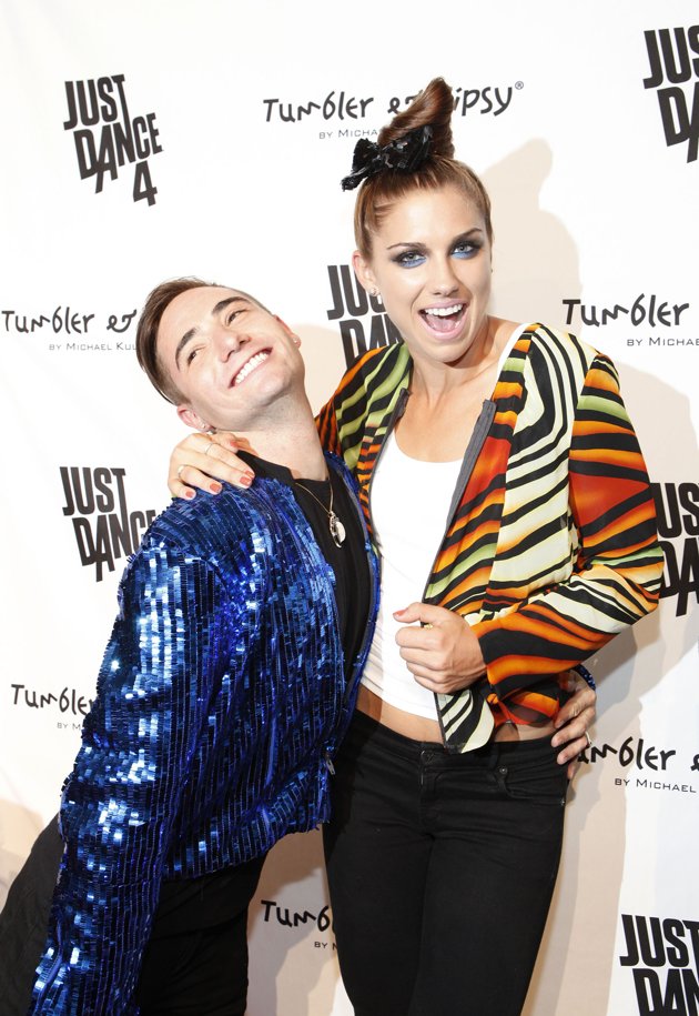 Michael Kuluva and Alex Morgan on the red carpet after walking the Tumbler and Tipsy New York Fashion Week Spring 2013 show.