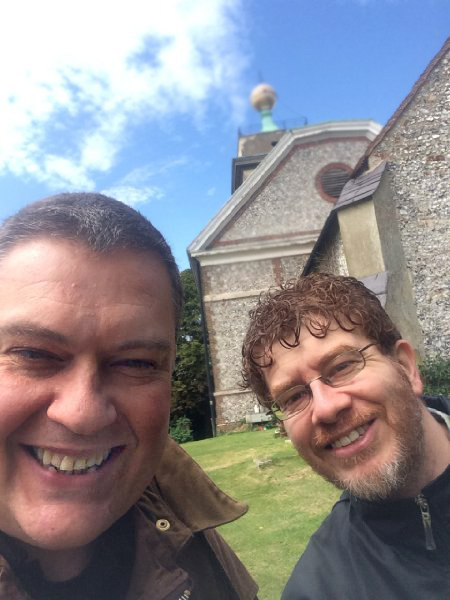 Outside the church of St Lawrence at West Wycombe, seen here with Dr Paolo Russo on a production recce researching 'Hellfire'.